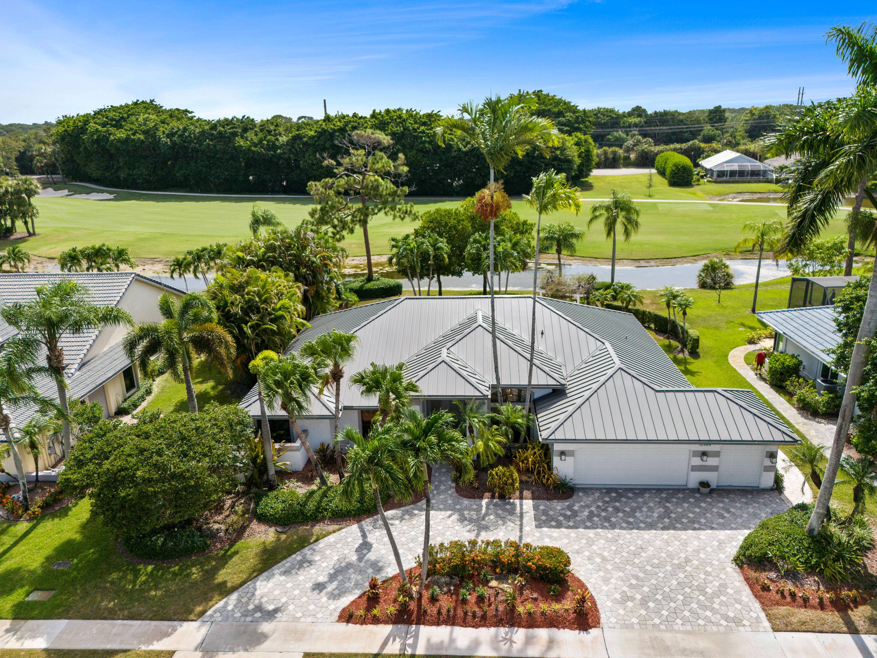 Welcome to 10984 Boca Woods Lane, an exquisite residence nestled in one of Boca Raton's most desirable country clubs, Boca Woods.