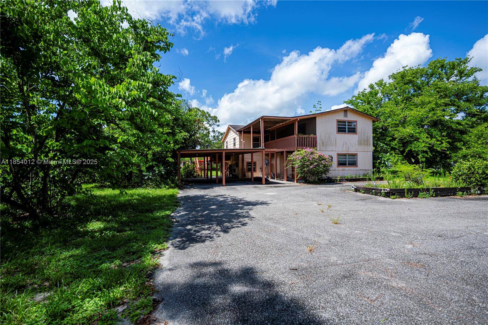 This large 5 bedroom 3 bath home is ideally situated on a beautiful tract of land 2.