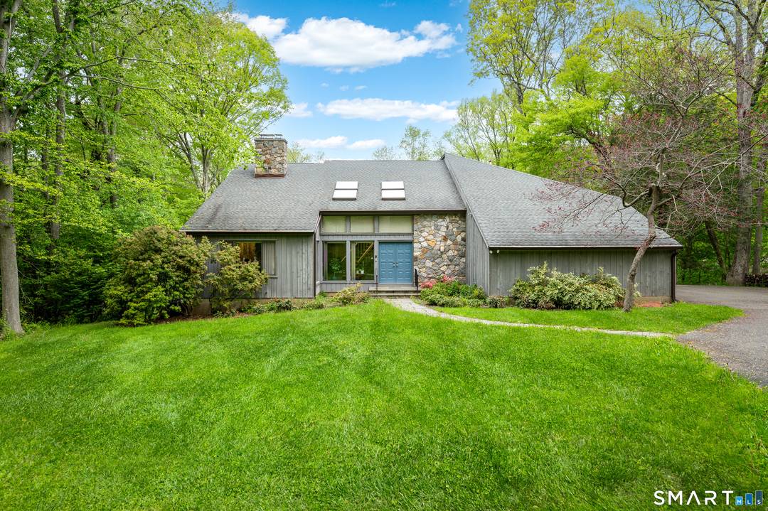 Perched on a scenic ridge overlooking the bucolic waters of Oriental Lodge Pond, this exceptional contemporary home is a sanctuary for those who crave a connection to the outdoors.