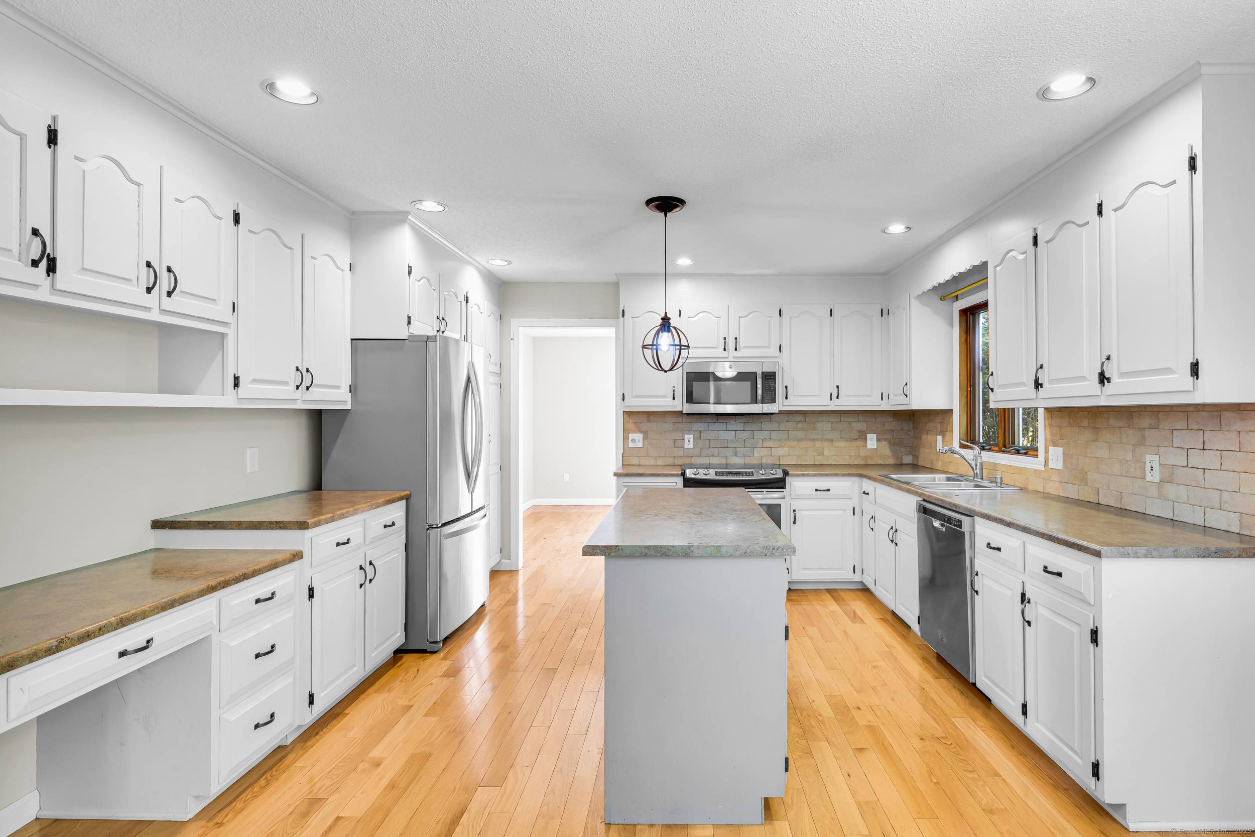 Welcome to 67 Cedar Ridge Drive, sitting peacefully at the end of a quiet cul de sac in Watertown.