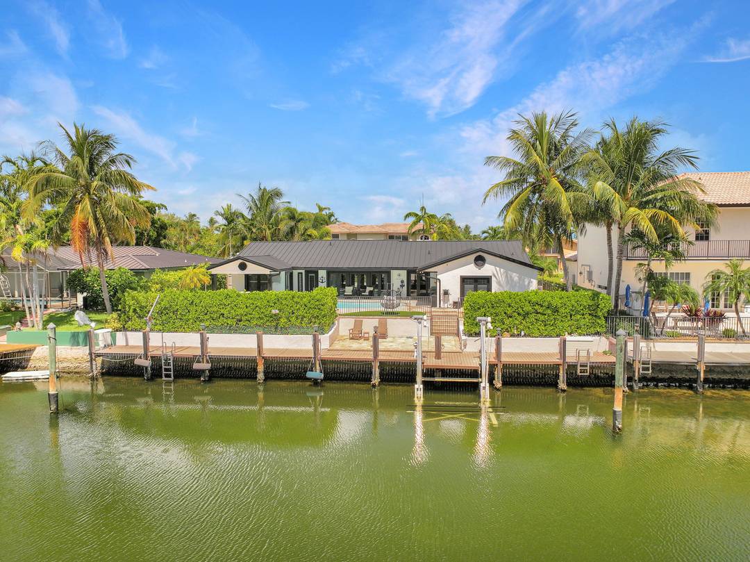 This beautifully redesigned estate in Venetian Isles offers 90 feet of waterfront and a private dock, ideal for those who desire the ultimate in coastal living.