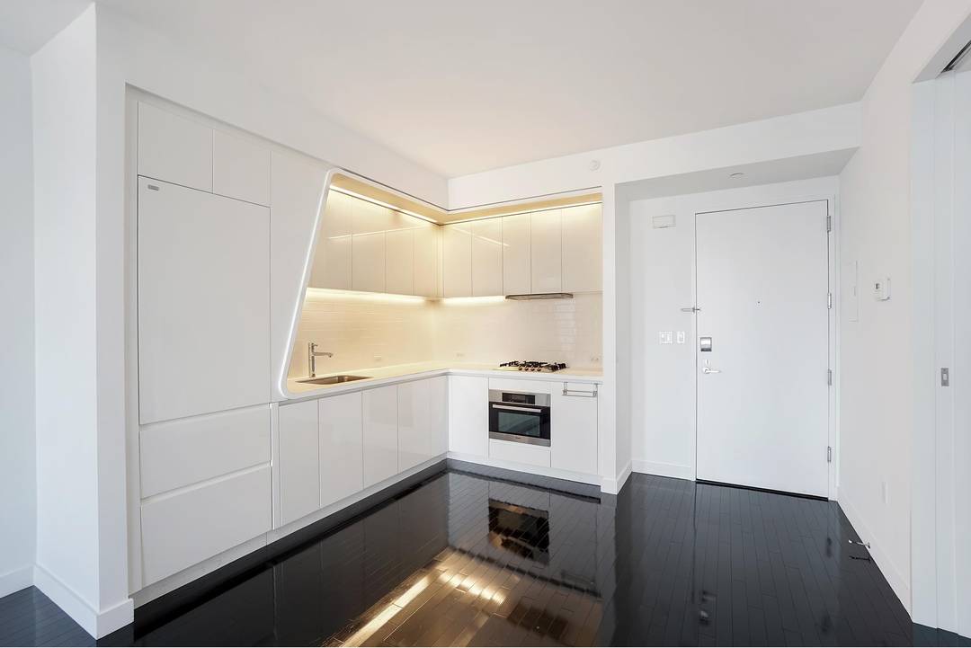 Impeccably styled one bedroom apartment on a high floor with stunning northern views of NYC's skyline, 9 11 Memorial Park, Statue of Liberty, and beyond.
