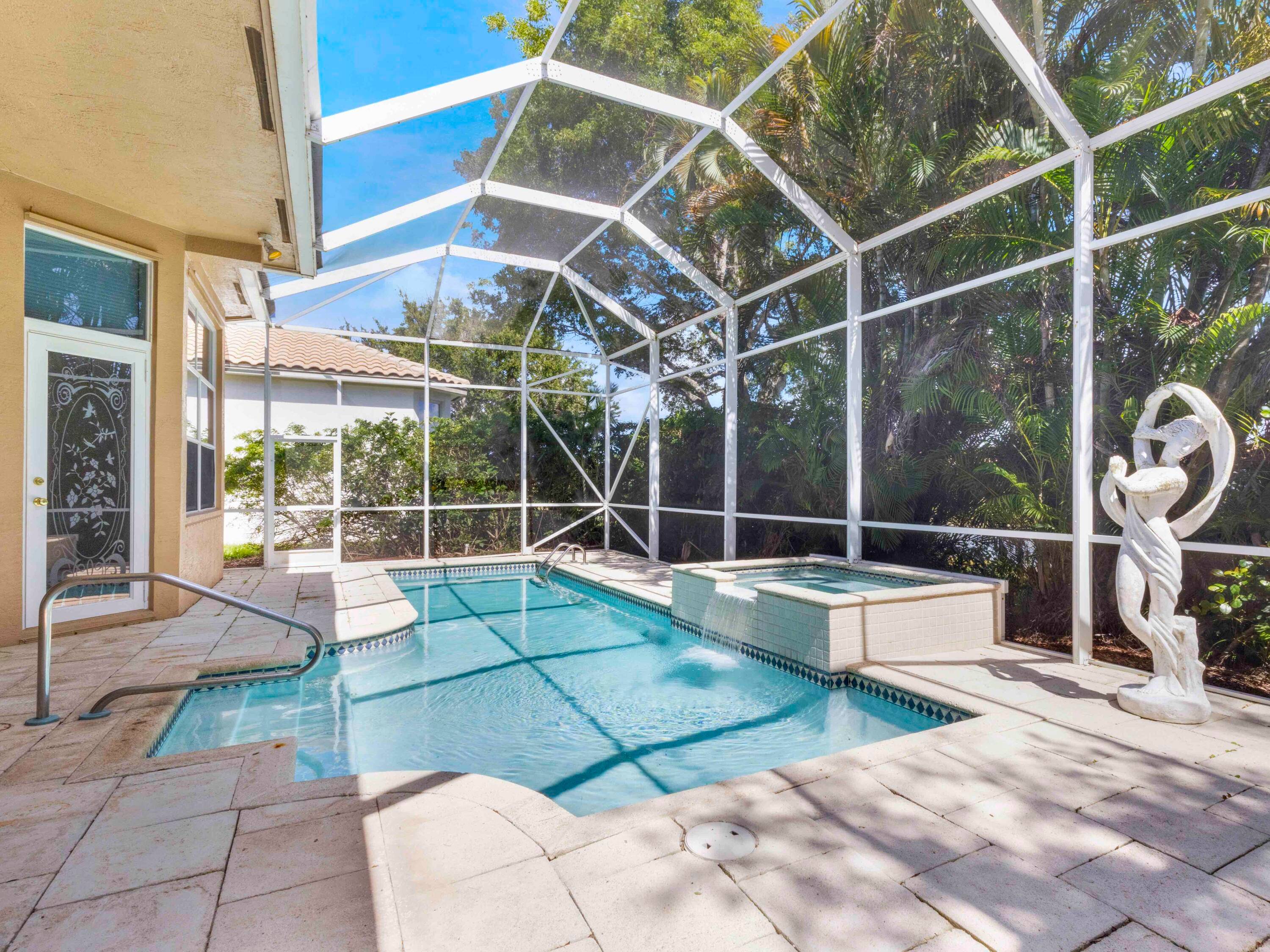 SELLER FINANCING EXTRAORDINARY WATERFRONT HOME WITH GRAND ENTRANCE AND GORGEOUS LAKE VIEW WITH SPA POOL IN ONE OF WELLINGTON'S TOP COMMUNITIES.