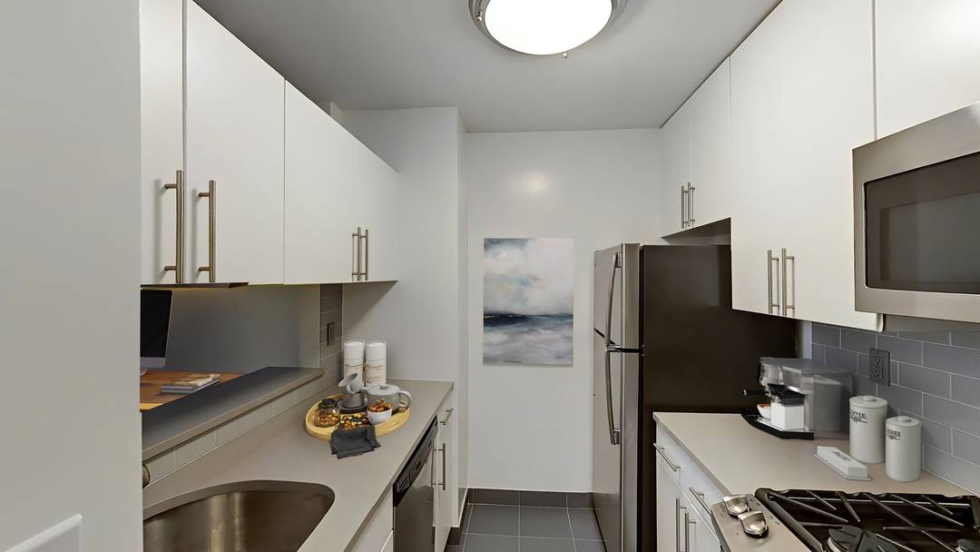 Spacious one bedroom with gourmet kitchen with stainless steel appliances and stone countertops, multiple closets including a walk in, and wood floors throughout.