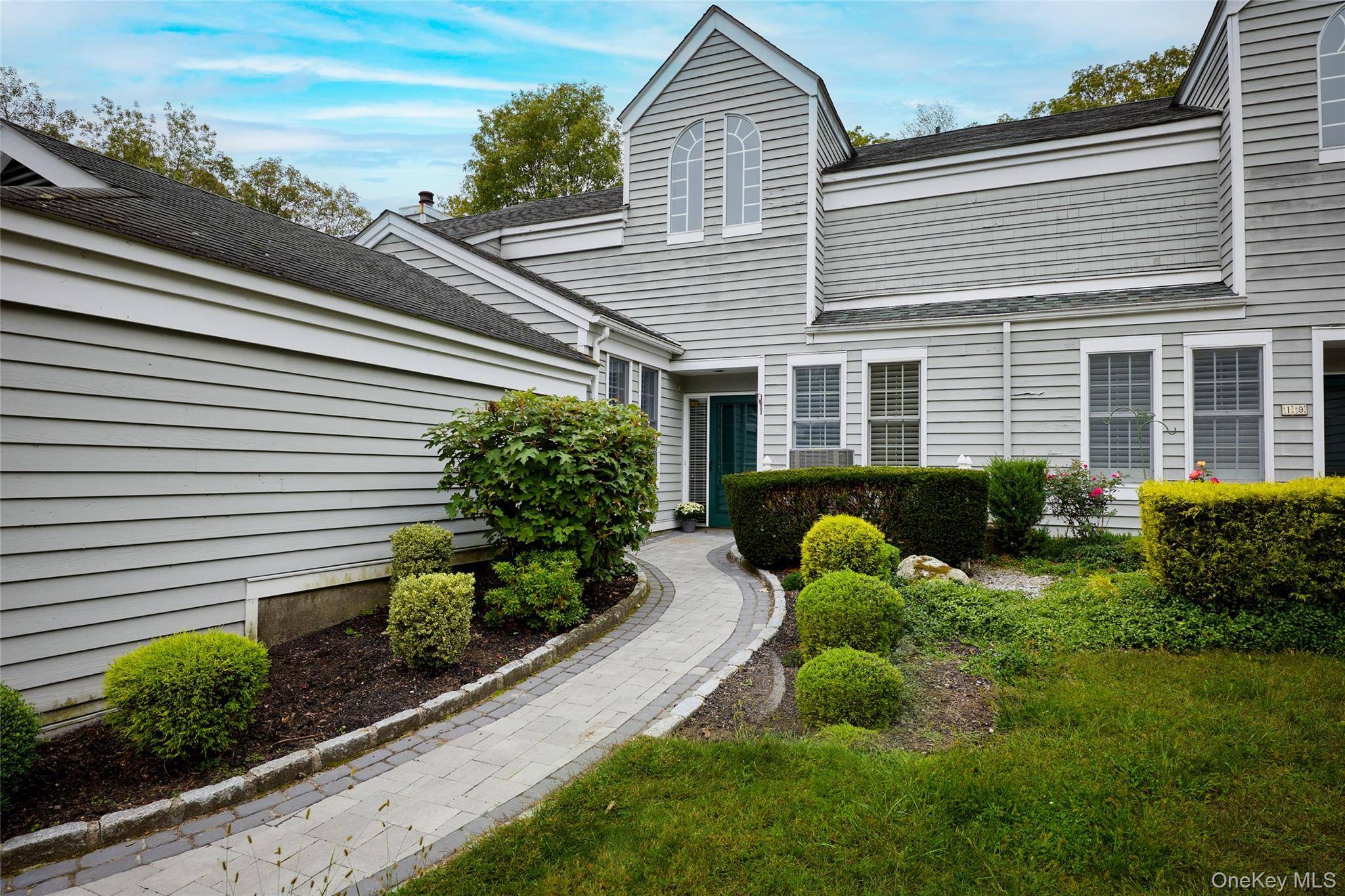 Charming and stylish two level townhome located in The Woodlands at Tuxedo.