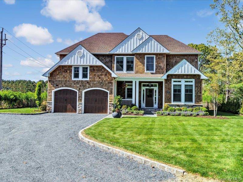 Constructed in 2021, this stately 4 bedroom traditional has all the amenities to make for a memorable summer.