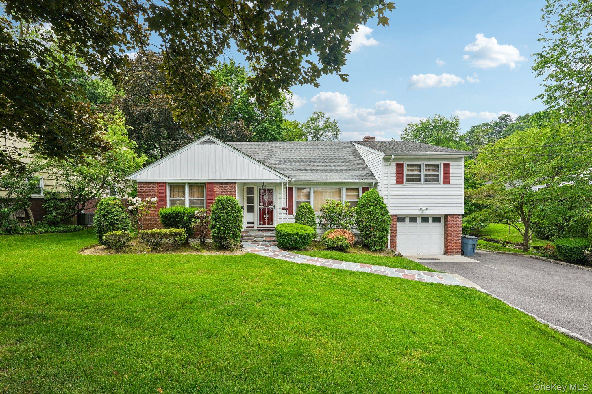 Discover this delightful split level home situated on a tranquil, tree lined street.