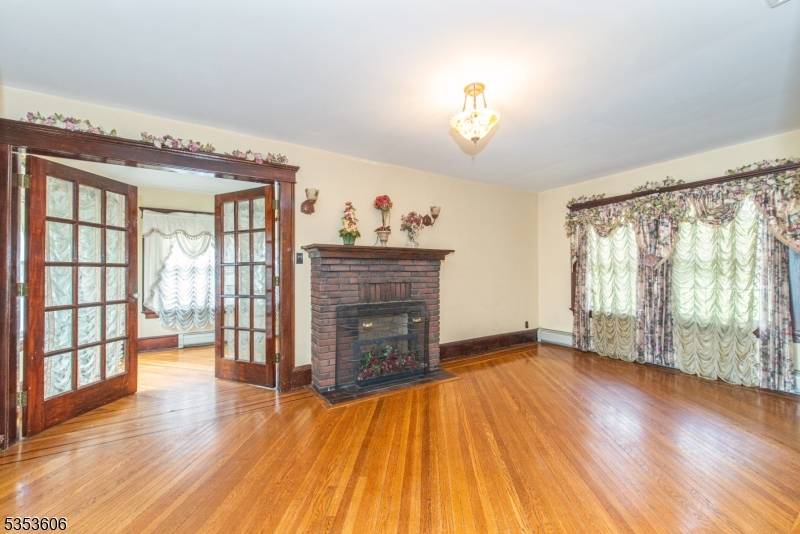 Crown molding, hardwood floors, wall to wall windows all add to the charm of this 8 room Colonial !
