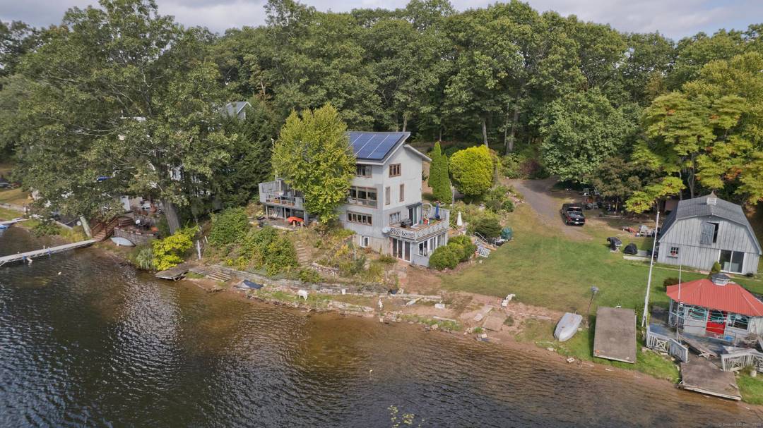 Modern contemporary sitting on 200ft of waterfront beauty on the South Pond leg of Congamond Lakes.