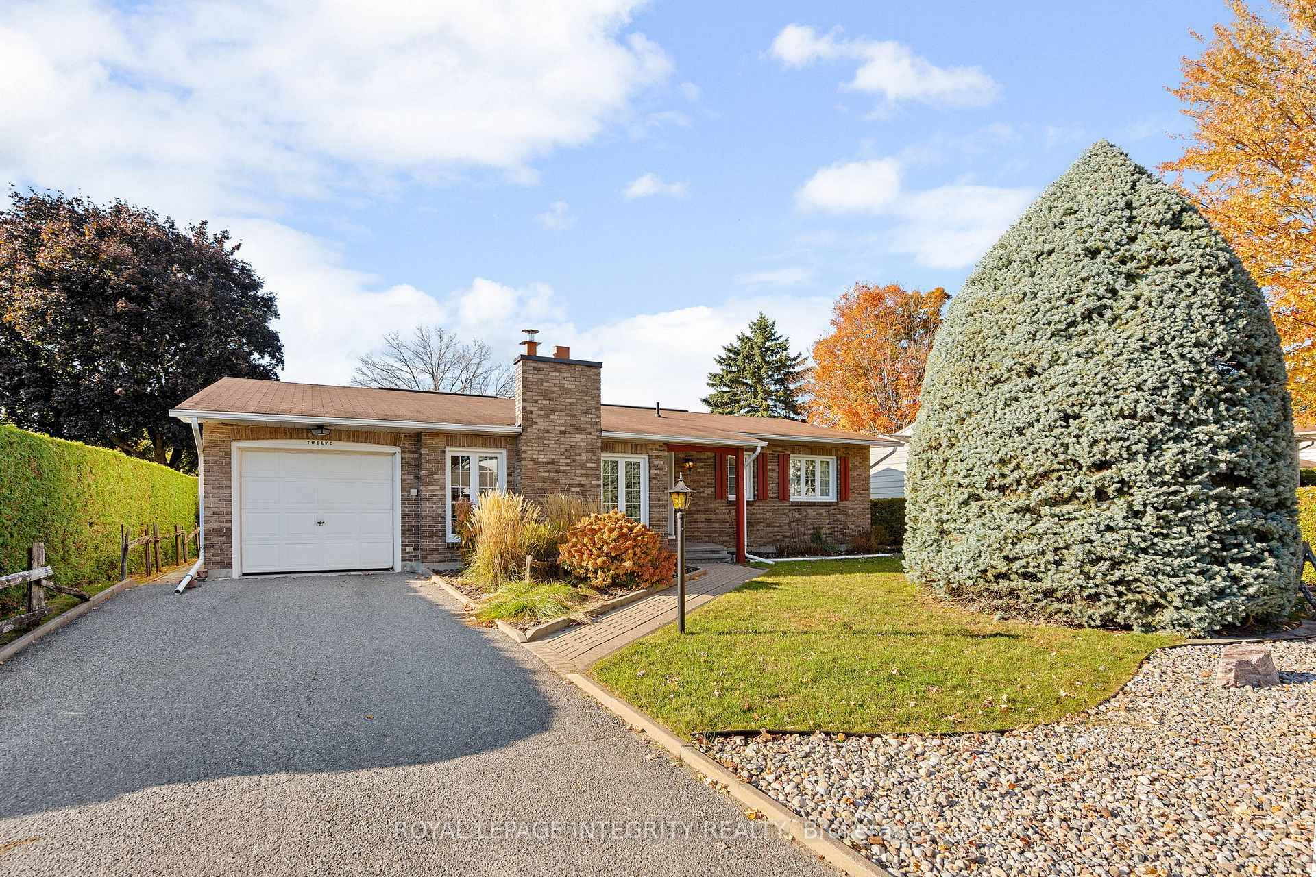 Meticulously maintained by its original owner, this charming detached bungalow is nestled on a quiet street in the heart of sought after Craig Henry.
