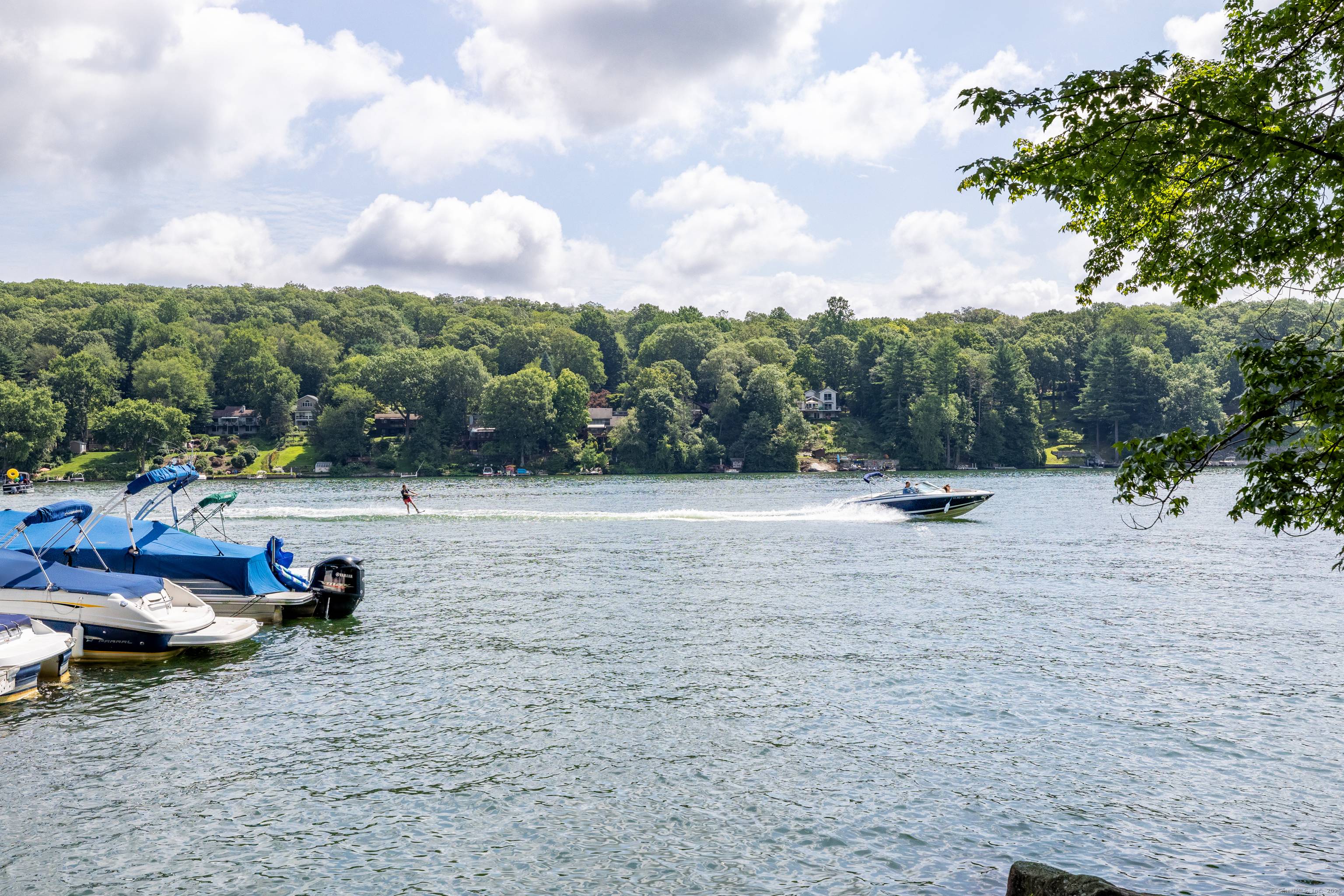 Located in lower litchfield county, through rolling hills, horse farms and pastures, and set a short stroll away from a sandy beach and boat dock on Candlewood lake, this updated ...