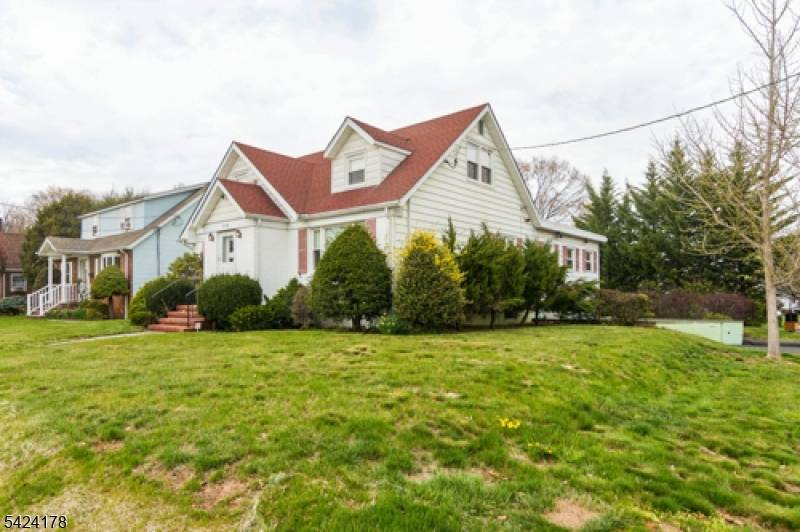 Welcome to this beautifully designed custom expanded Cape Cod home, nestled on a desirable corner lot in the charming Sunnyside section of Linden.