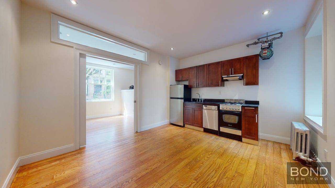 Sparkling 1 bedroom apartment features large living room, an open kitchen with stainless steel appliances and a dishwasher, queen size bedroom, hardwood floor and high ceilings.