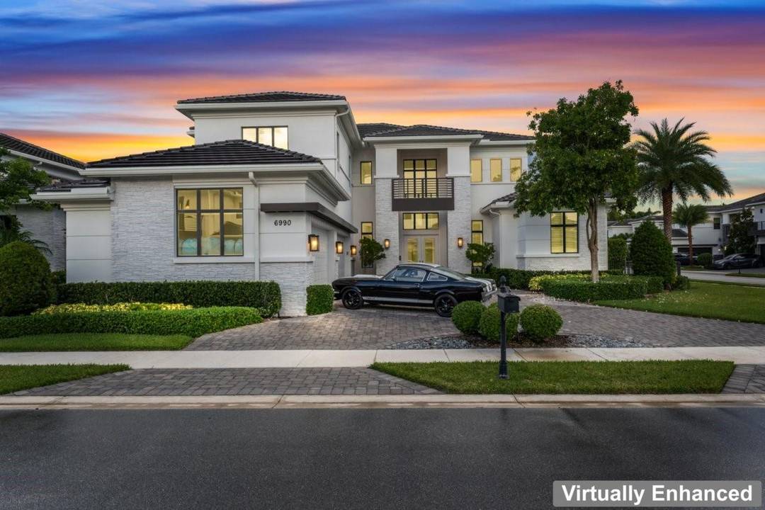 ULTIMATE LUXURY ON A PREMIER OVERSIZED LOT.