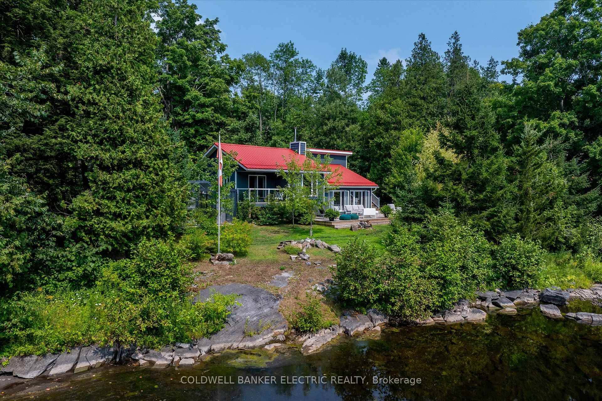 Magnificent year round waterfront retreat offering approximately 675 feet of river frontage, as well as space to build a bunkie, tucked away on 1.
