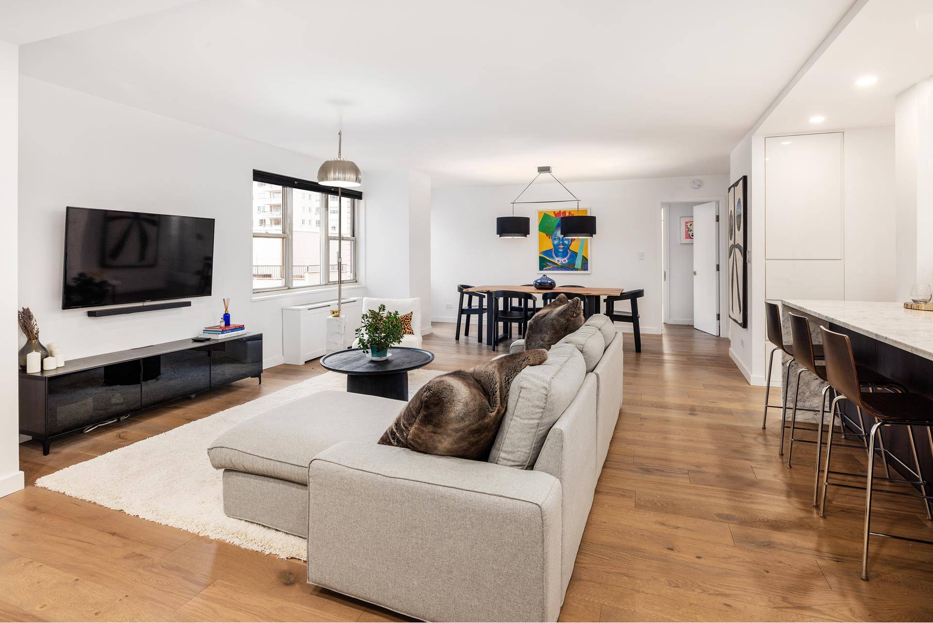 Discover this stunning, sun drenched, east facing, two bedroom, two bathroom co op apartment at the prestigious 201 East 66th Street.