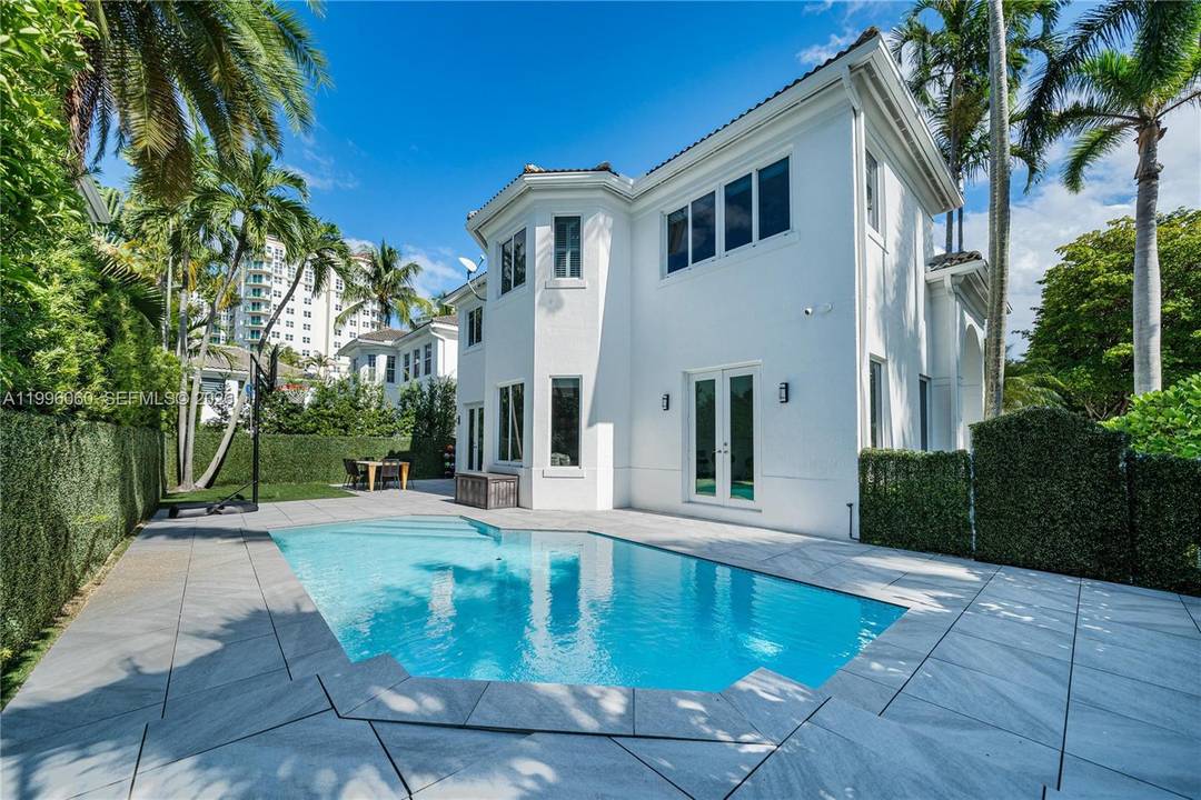 Rare opportunity to own a two story pool home with a 2 car garage in the gated community of Country Club Estates, one of Aventura s most desirable neighborhoods, set ...