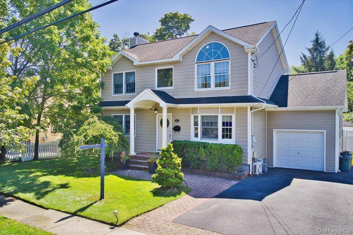 Welcome to this Double Dormered Home with Catherdral Ceilings and Entry Chandelier.
