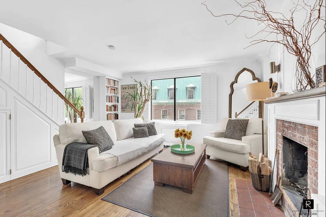 Penthouse Unit 7 at 149 West 85th Street is a bright and well proportioned residence featuring a seamless open layout, hardwood floors, and a charming fireplace that anchors the living ...
