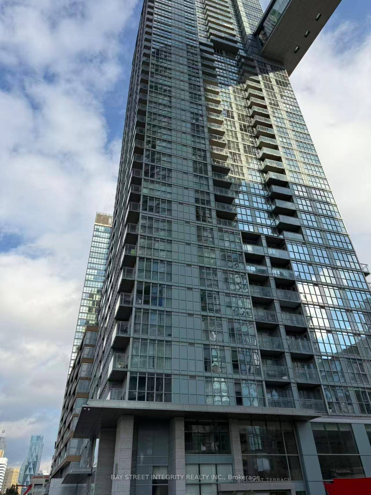Bright and spacious 1 Den unit with a functional layout and open balcony at Parade Condos, located in the heart of downtown Toronto !