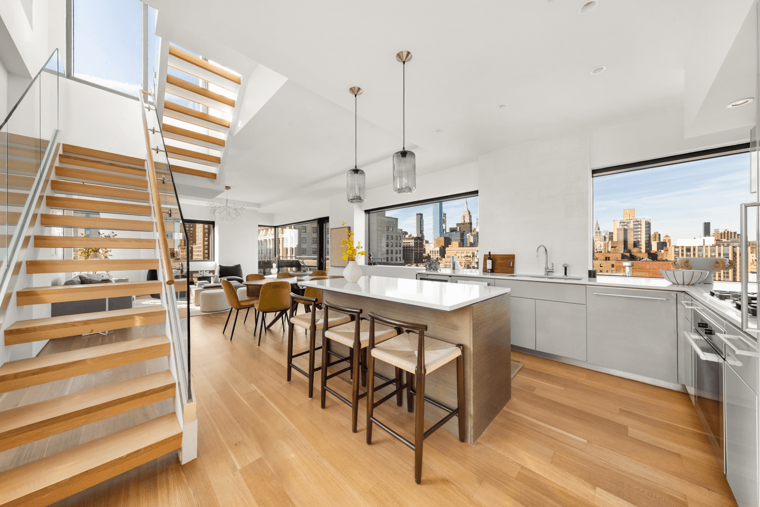 Welcome to this top floor duplex penthouse with three terraces, a solarium, and breathtaking 360 degree views of the Midtown and Downtown Skylines.