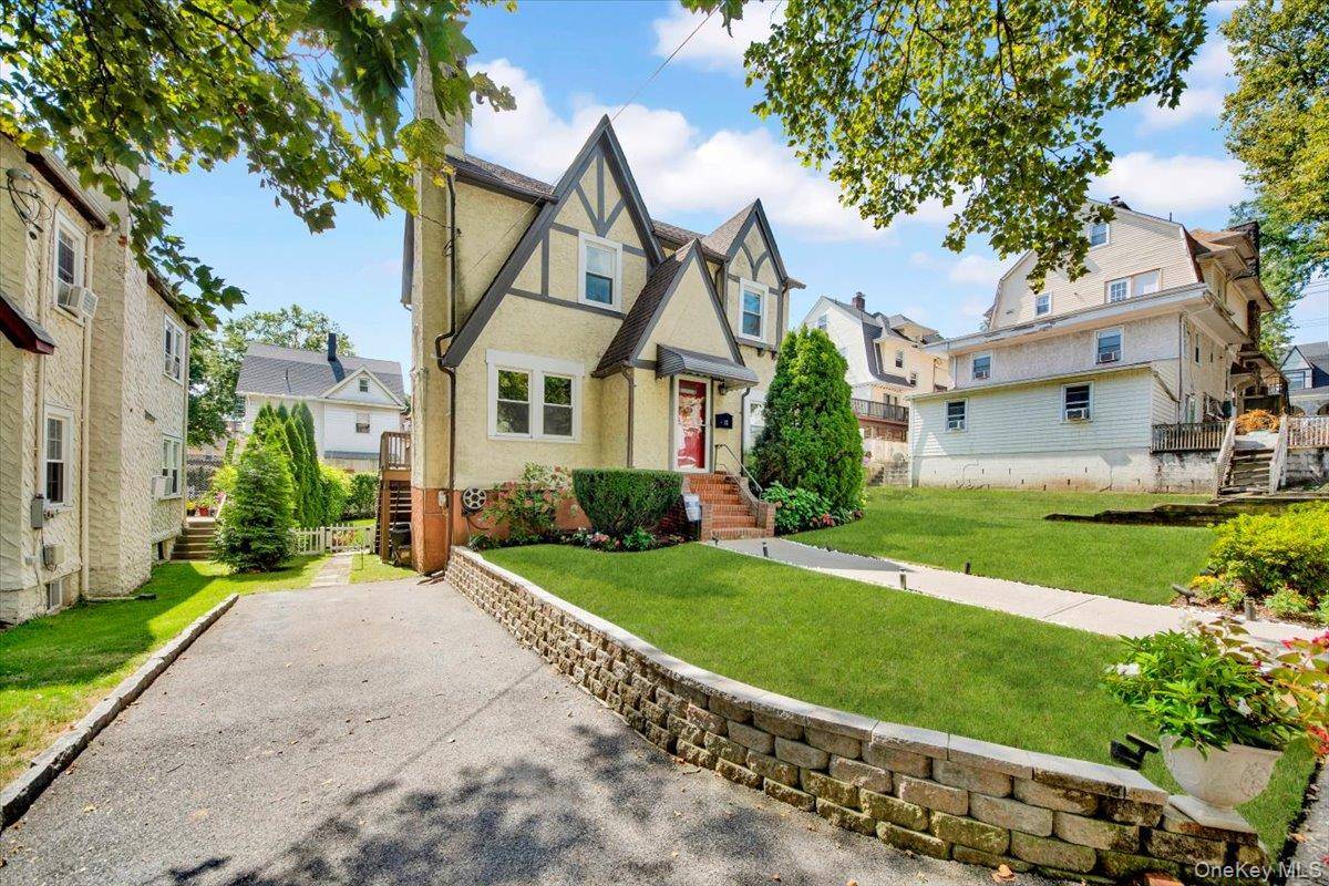 Welcome to 12 Crest Avenue a beautifully updated Tudor style home that perfectly blends classic charm with modern updates.