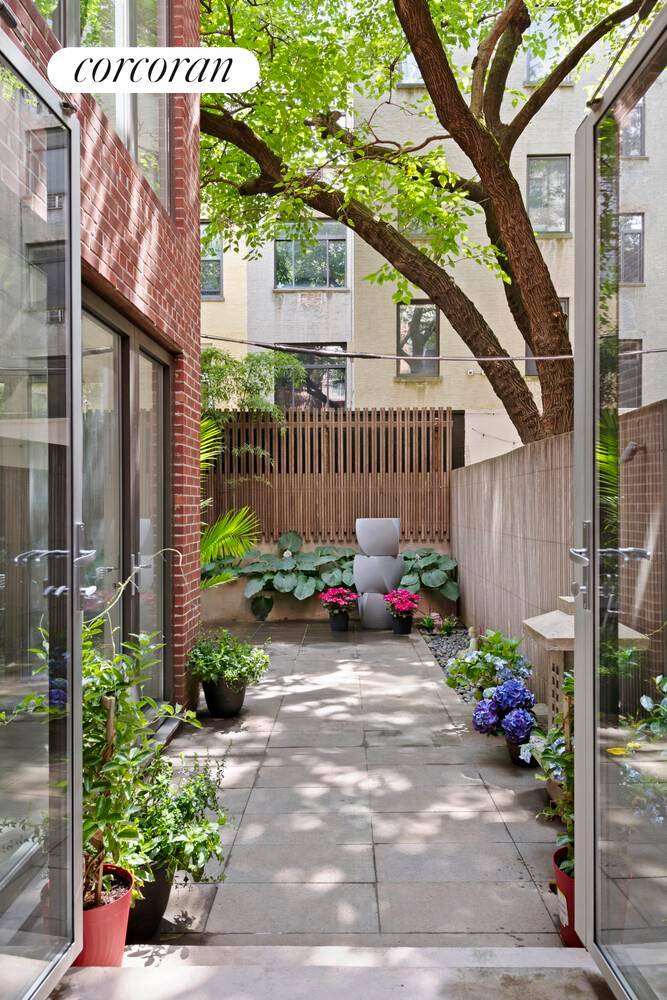 Modern Loft Style Duplex with Private Garden Near Central Park Welcome to this rare and remarkable 4 bedroom, 5 bathroom duplex nestled in a boutique prewar building on a coveted ...