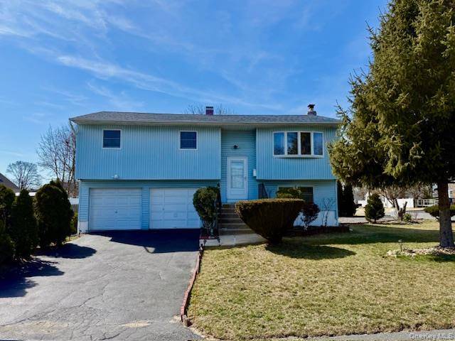 Welcome to this charming hi ranch home offering versatility and space for comfortable living.