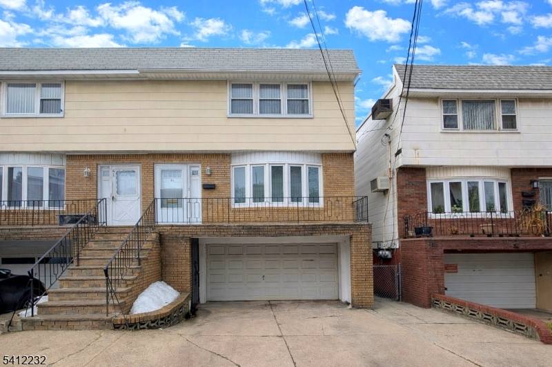 Welcome to 43 Corbin Ave, an exceptional semi attached two family home ideally located in the heart of Jersey City's desirable Marion Journal Square area.