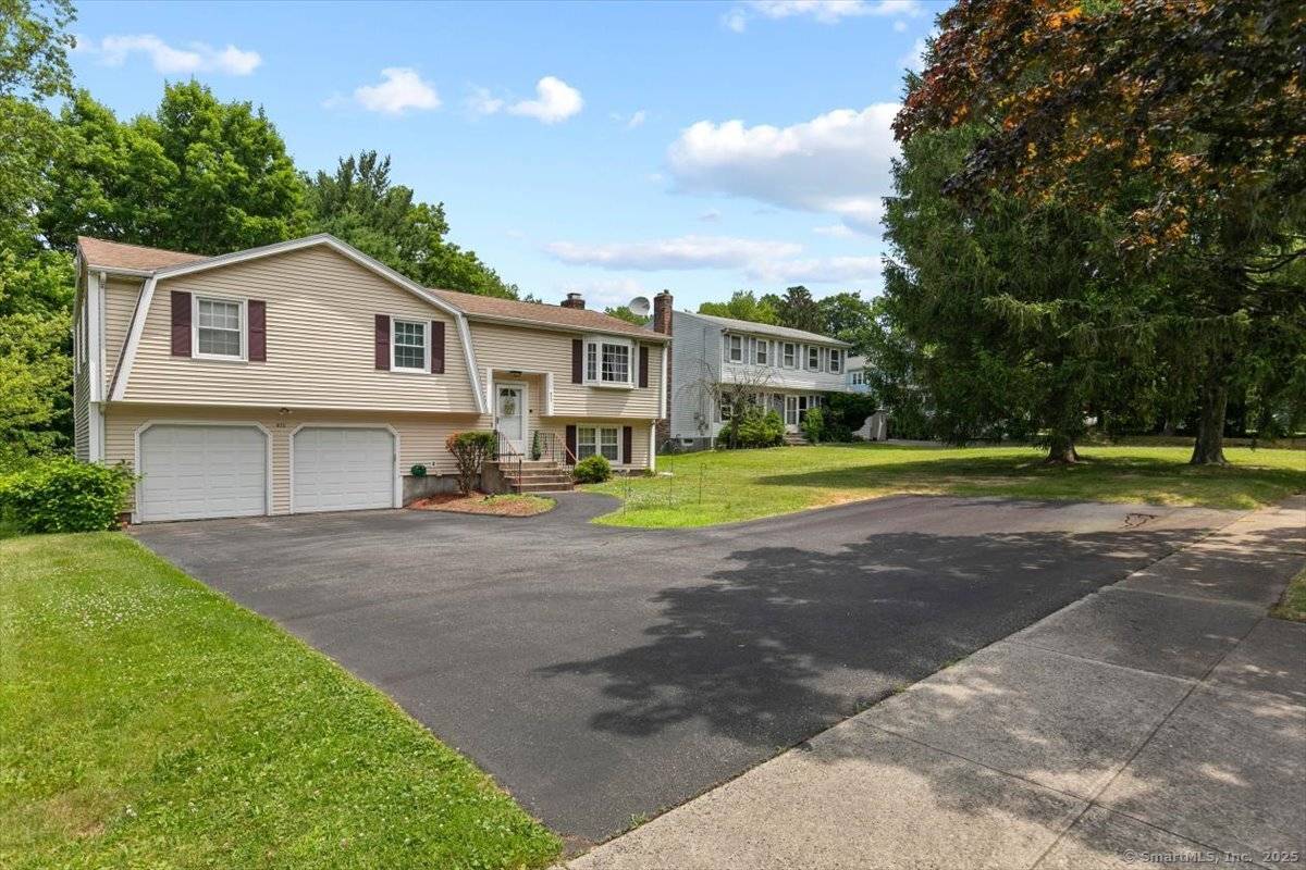 Welcome to 822 New Haven Avenue Discover this charming raised ranch nestled in the heart of Milford.