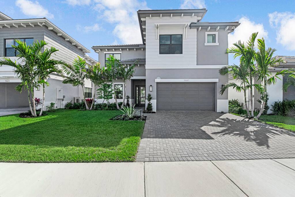 Rare opportunity to own a brand new lakefront home in the prestigious master planned community of Avenir in Palm Beach Gardens.