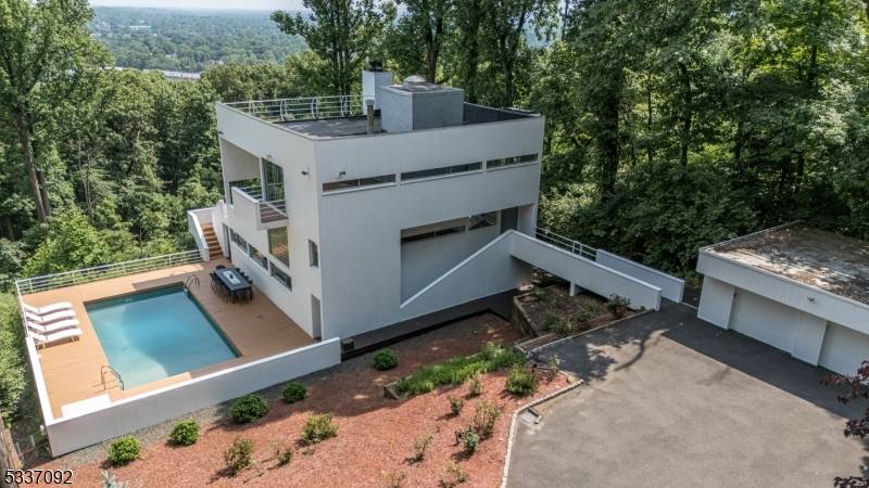 Incredible Custom Contemporary home w Master Suite, Walk out Finished Basement, In Ground Pool, Loft, Rooftop Office, Detached 2 Car Garage in desirable Watchung is unlike any other !