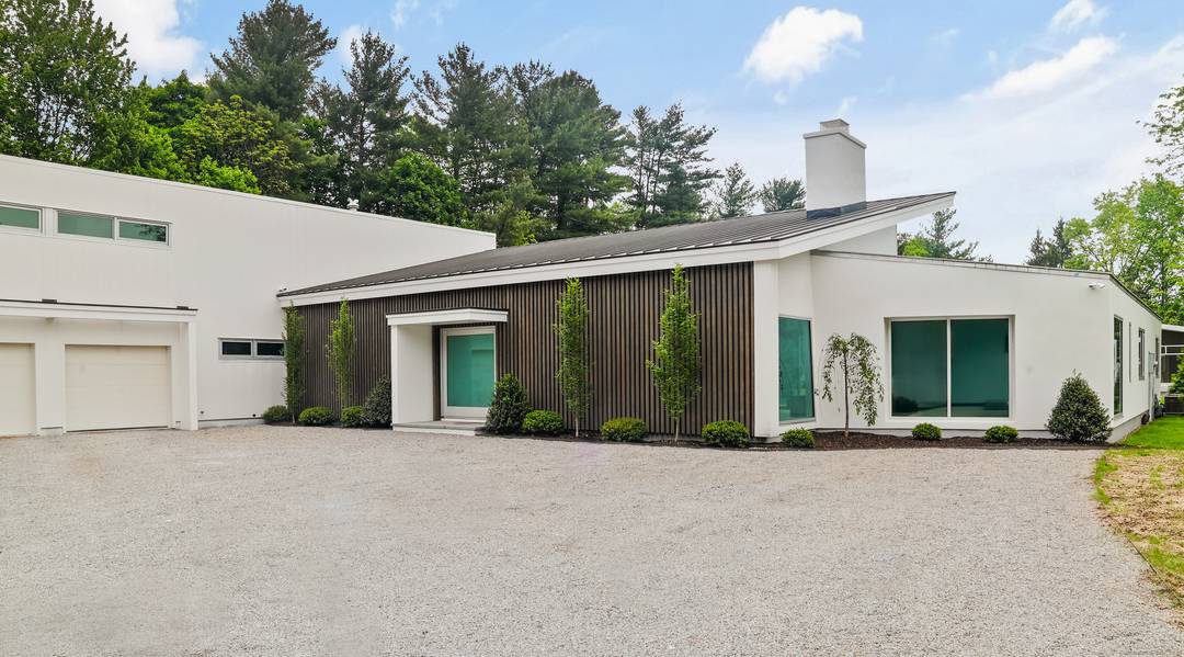 A masterful full renovation by acclaimed Coastal Luxury Homes, this extraordinary modern residence redefines sophistication in the heart of Westport.