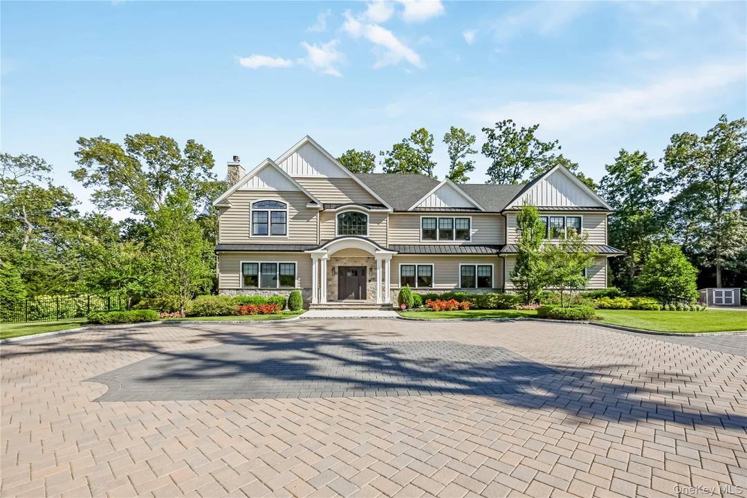 Welcome to your dream home an elegant gated 9 room Colonial nestled in one of the most vibrant and sought after suburban communities.