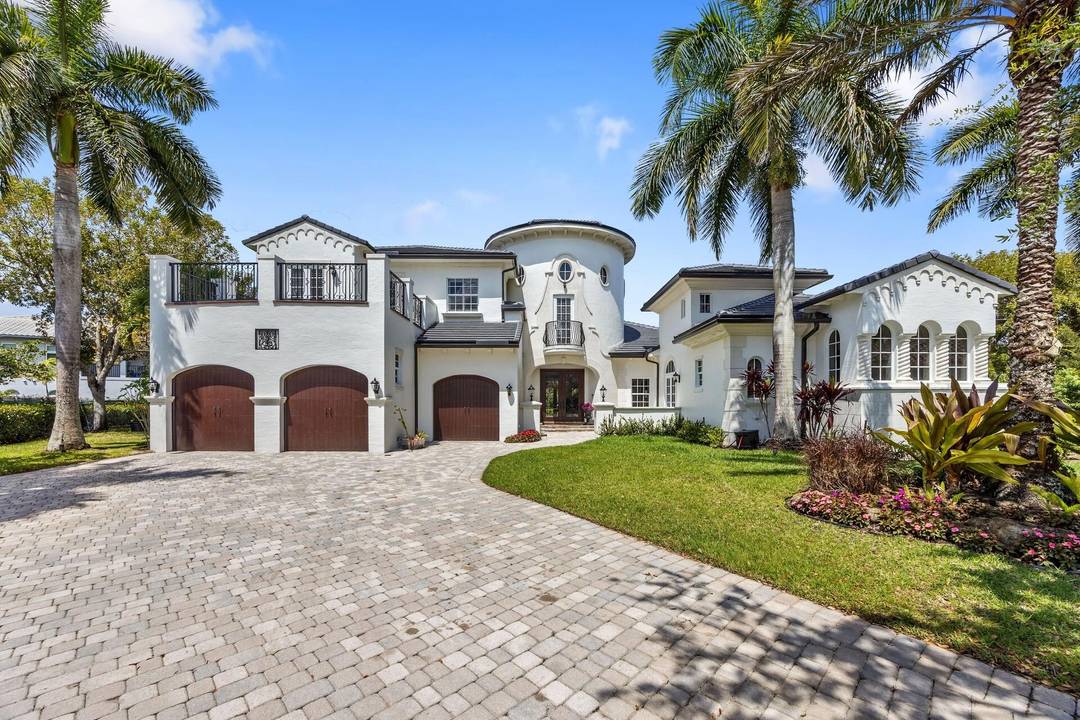 Welcome to an exceptional waterfront estate nestled within the prestigious Heron Estates subdivision of Heron Bay in Parkland.