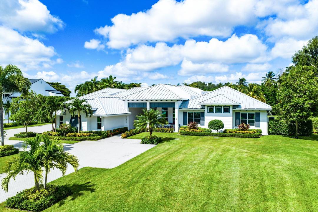 Tucked behind the gates of Fieldbrook Estates, one of Boca Raton's most exclusive communities of just 54 custom homes, this modern masterpiece sits quietly on a private one acre lot.