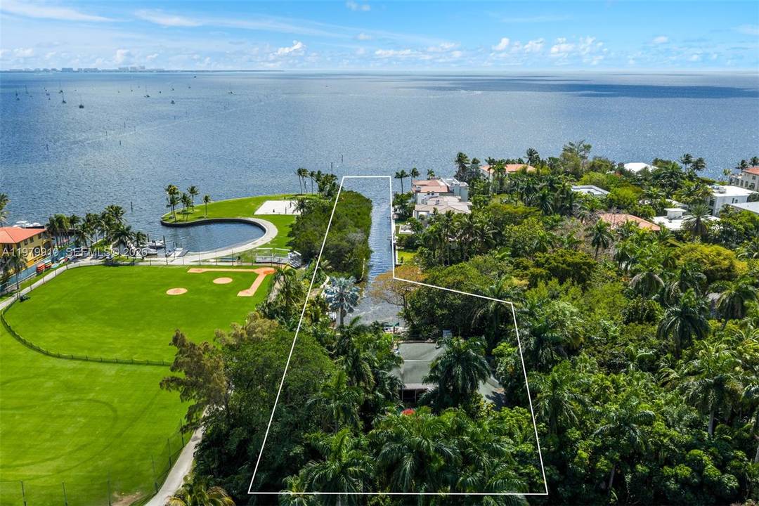 A rare opportunity to create a landmark waterfront estate within the exclusive gated enclave of Four Way Lodge Estates in Coconut Grove.