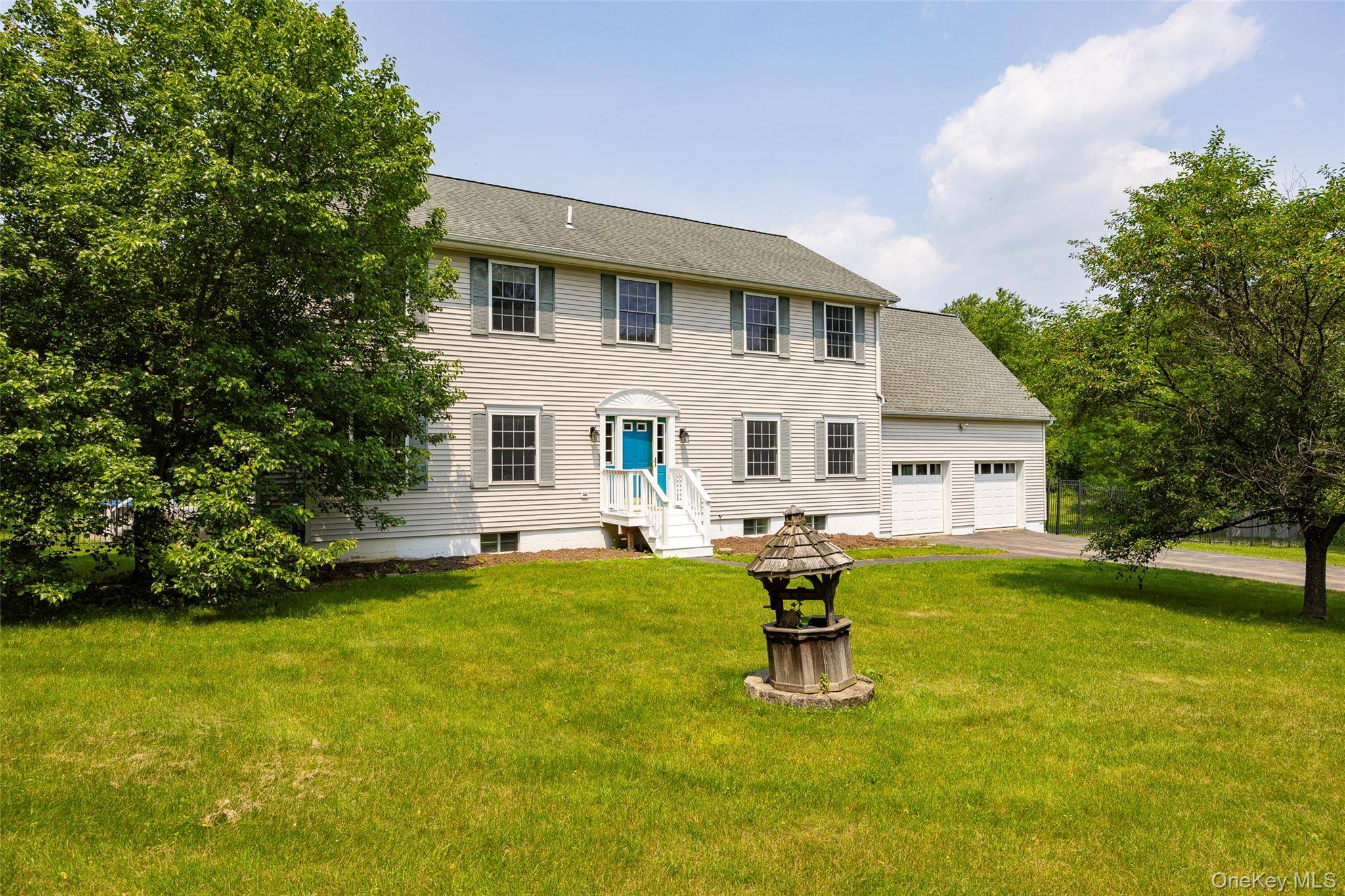 Center Hall Colonial style home in serene country setting.