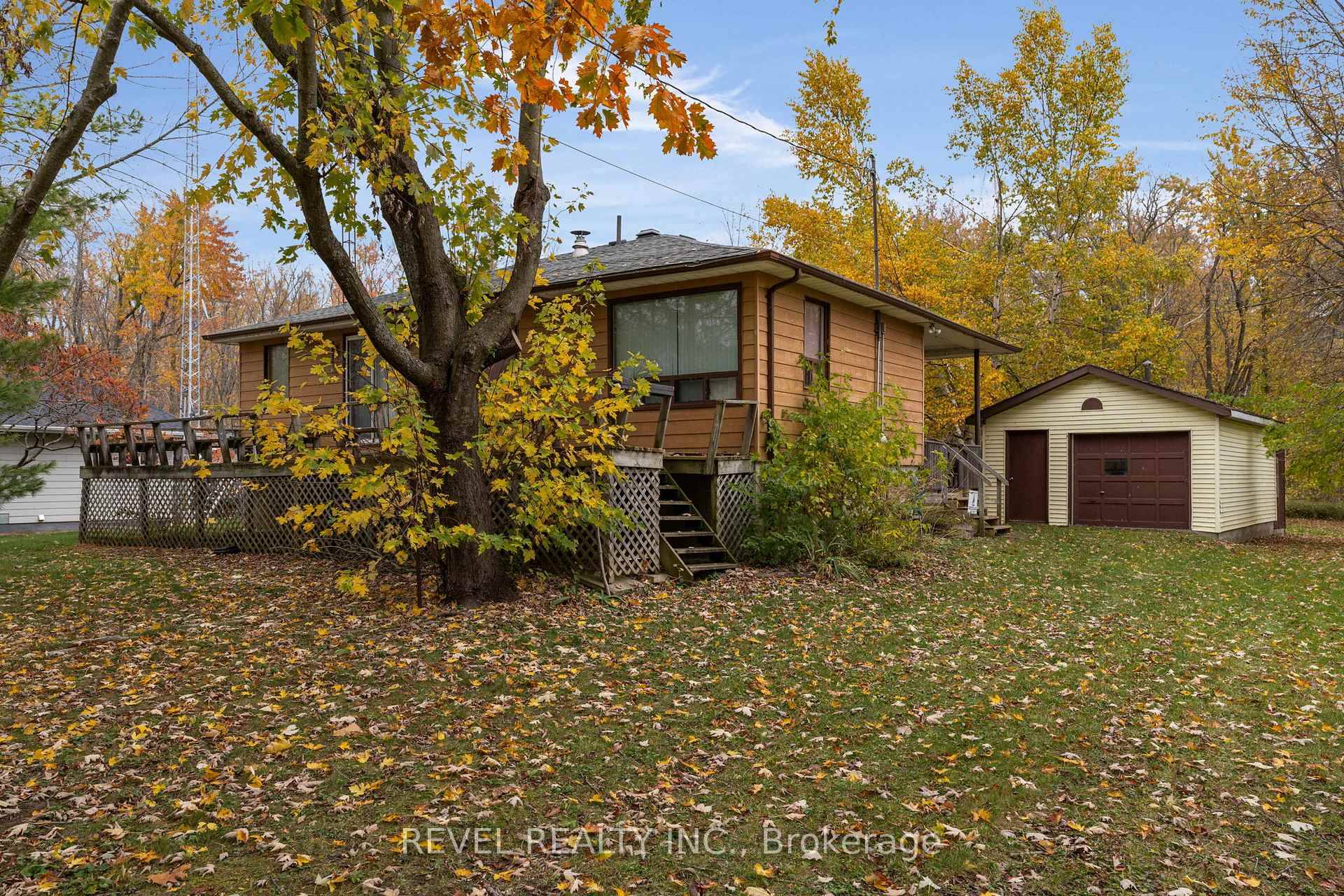Tucked away among the trees on a picturesque, nearly 300 foot deep lot, 6183 Sheba Drive offers a rare blend of peace, privacy, and potential.