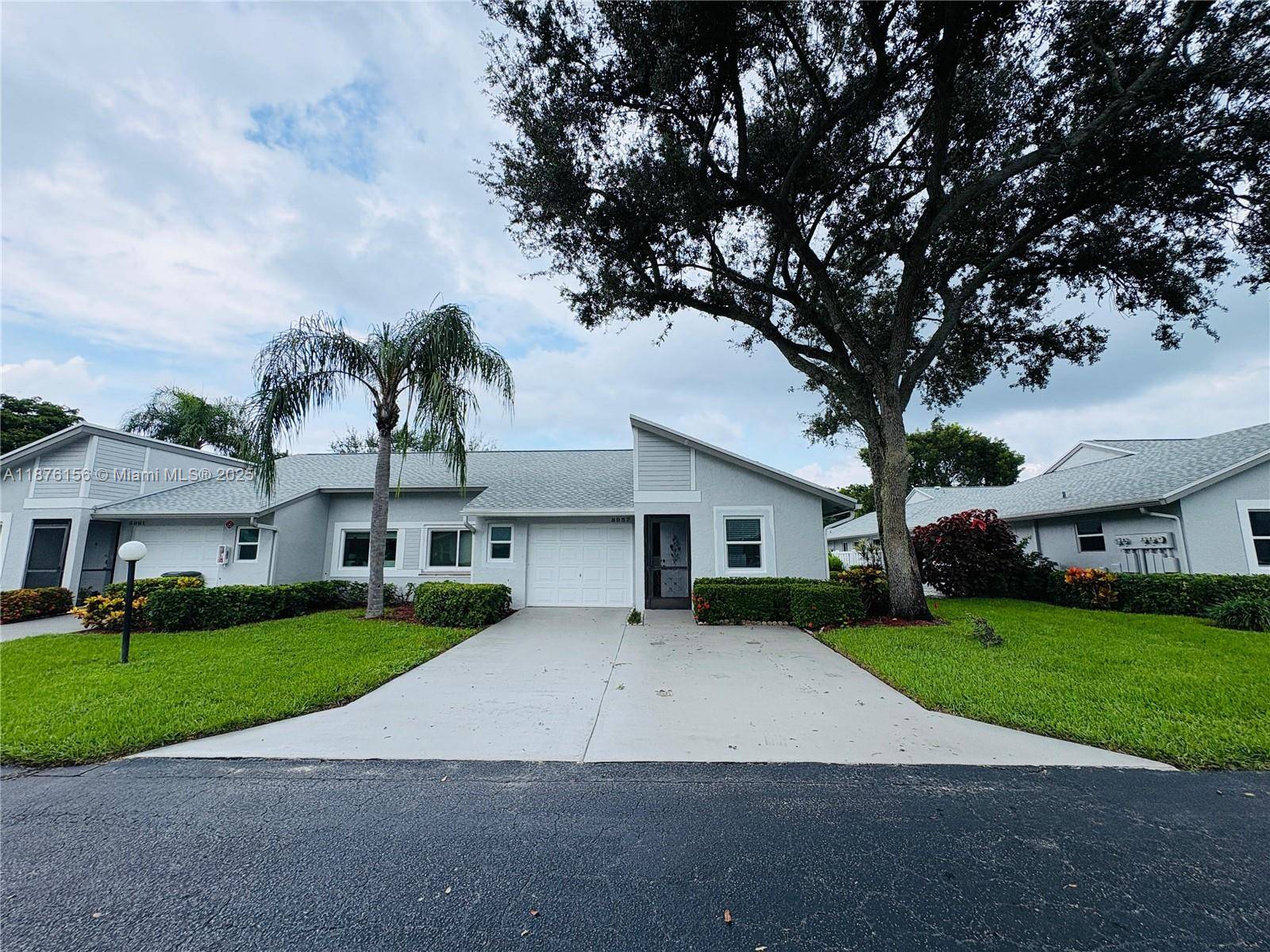 Welcome to this beautifully updated and cozy corner unit, one of the few with its own garage plus two additional parking spaces right in front.