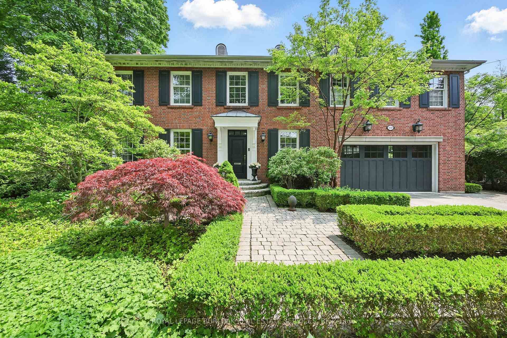 Welcome to a truly distinguished residence, nestled in the heart of coveted Roseland, where classic style and architecture blend perfectly in this beautiful red brick Colonial home.