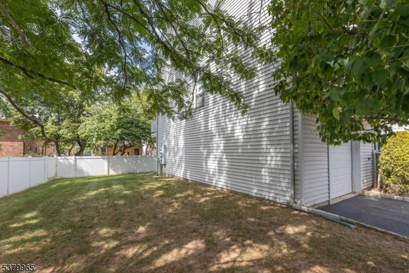 Welcome to this multi floor end unit Condominium located in the heart of Rahway.