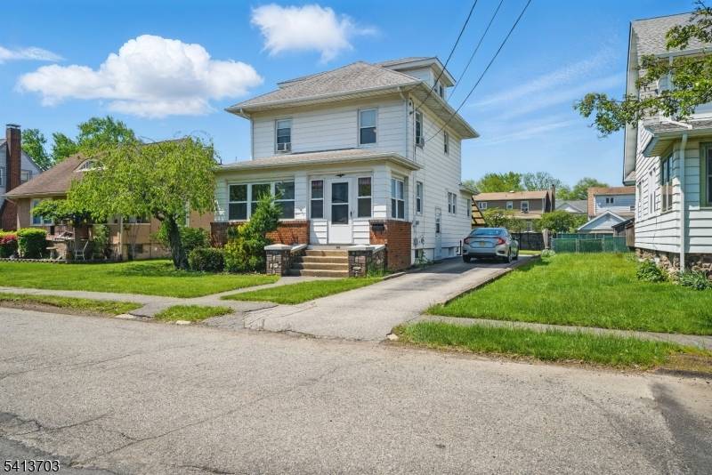 Sunlit 3 bedroom, 1 bath home with a welcoming front porch and hardwood floors.