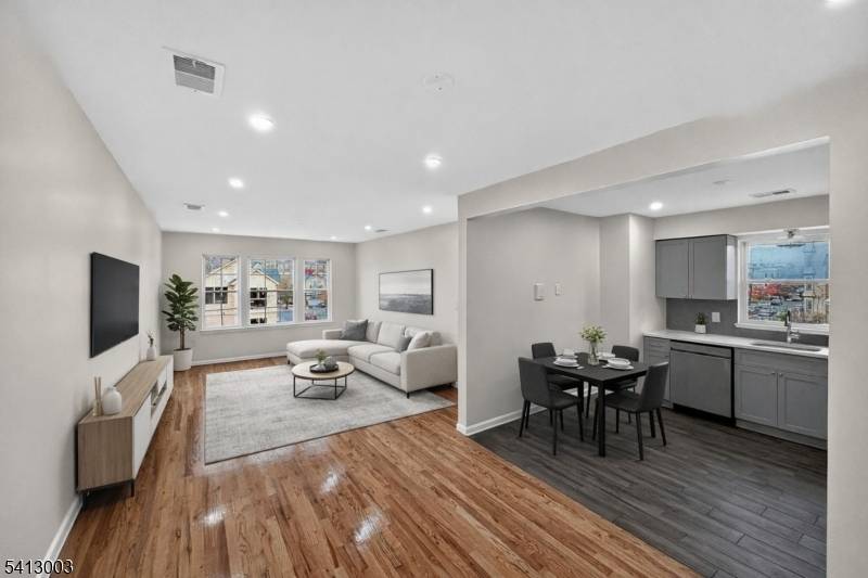 Indulge in the opportunity to own this elegant, spacious legal 2 family residence with a finished basement, offering scale and functionality.