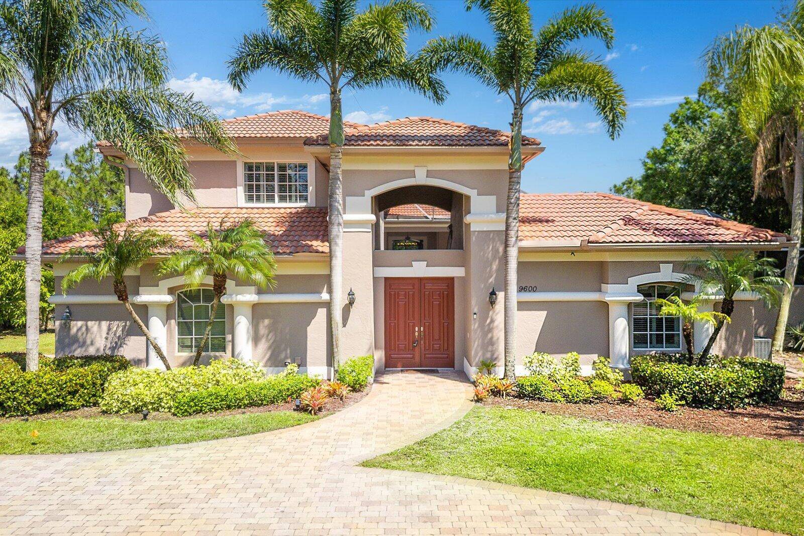 Nestled in the highly desired Enclave at PGA Village, this luxurious 5BR, 5.