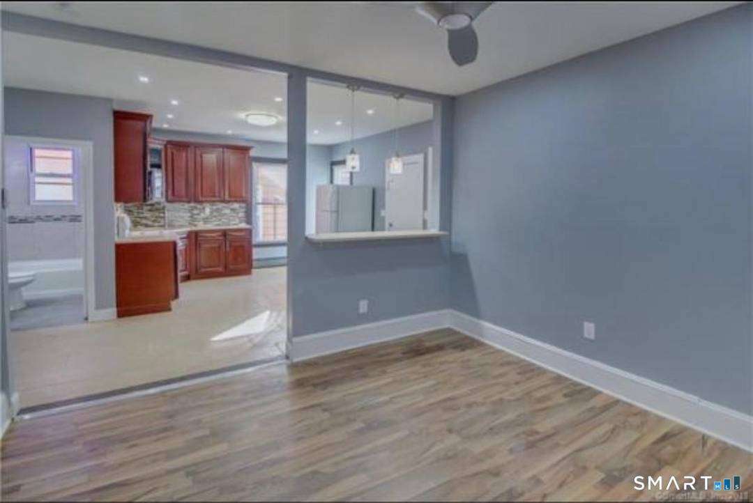 This well maintained two family home features two spacious units, each with three bedrooms, offering ample living space and comfortable layouts.