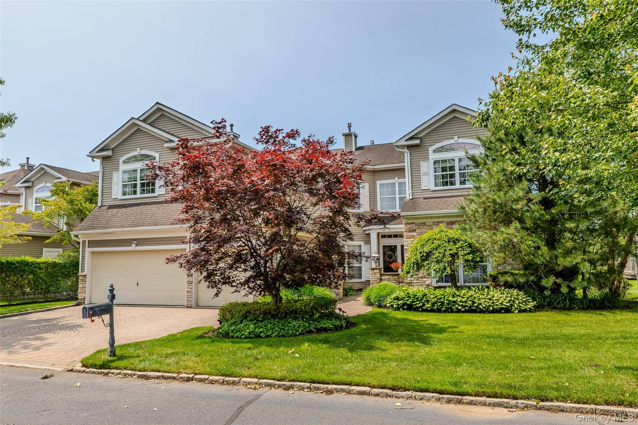 Tremendous Postmodern Home on 8th Green of The Gated Hamlet Golf Course with 3 floor Elevator.