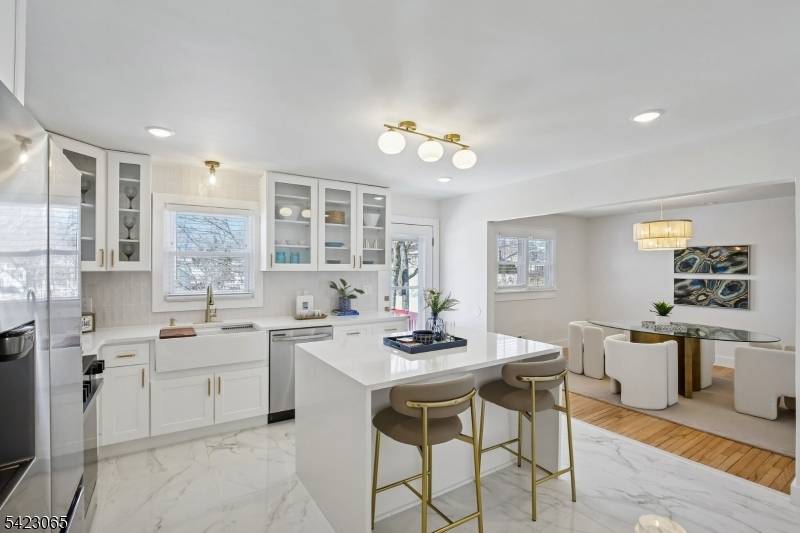 Set on nearly 1 3 of an acre, on a quiet street, this stunning home offers light filled rooms arranged in a spacious, flowing floor plan.