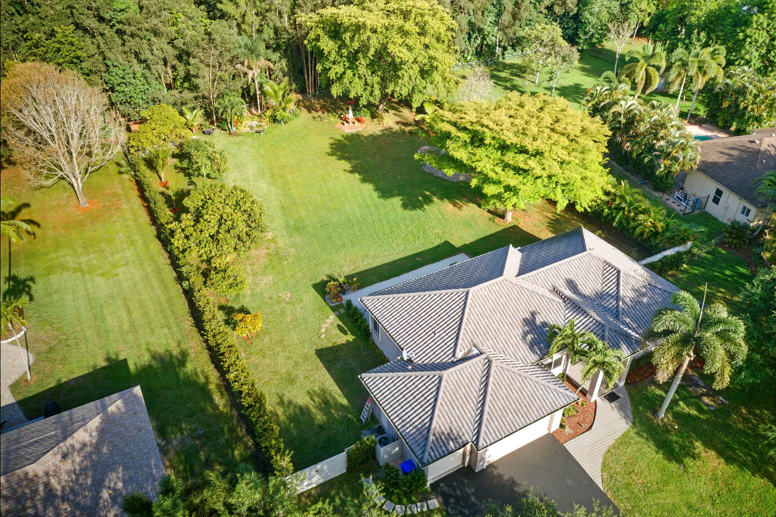 Experience luxury living in this beautifully renovated home featuring an open concept design and situated on a spacious one acre lot.