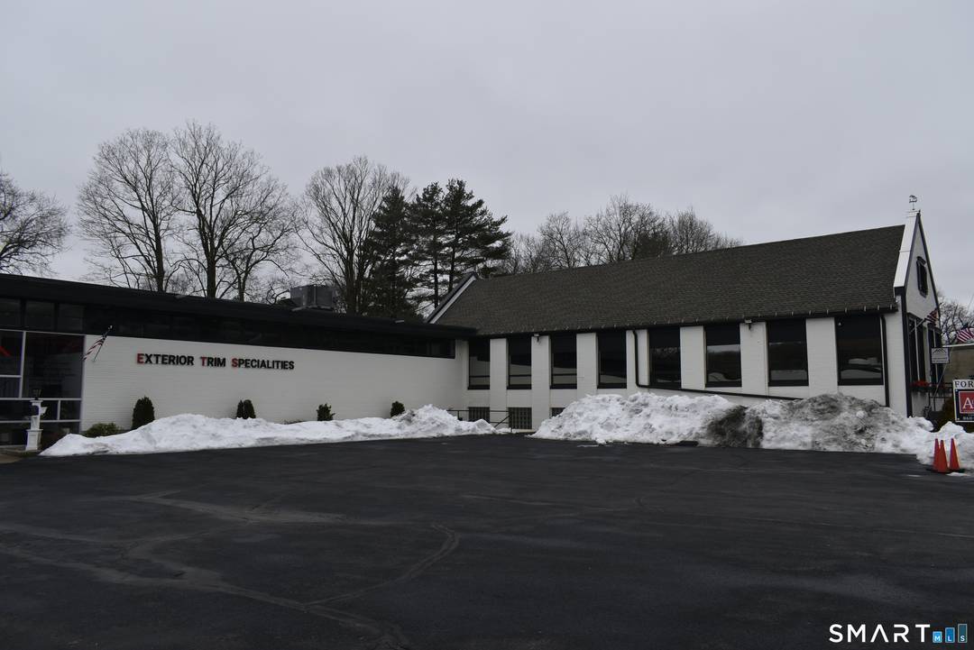 Remodeled and update commercial building with 3 possible economic units, office, warehouse and residential apartment with attached gym.